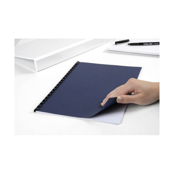 Hand lifting the navy leathergrain back cover of an A4 document bound with a black plastic comb on a white desk