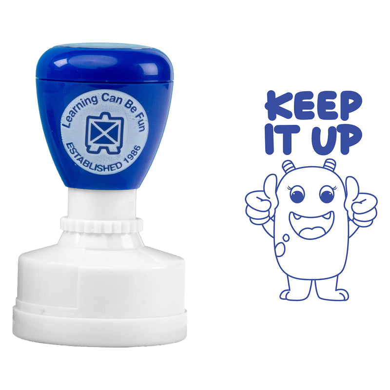 Product image showing the self inking Keep It Up stamp alongside its blue impression on a clean white background. The cheerful thumbs up character and bold text showcase the encouraging design used to provide positive classroom feedback.