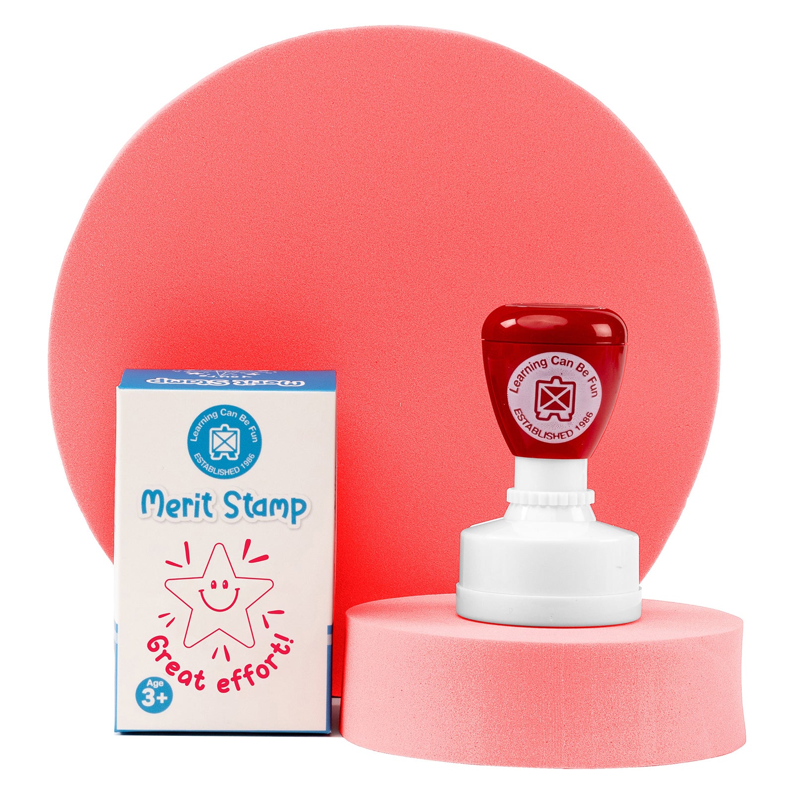 Retail packaging and Great Effort Merit Stamp presented together on a display platform. The product packaging showcases the friendly star design and educational reward theme suitable for classroom use.