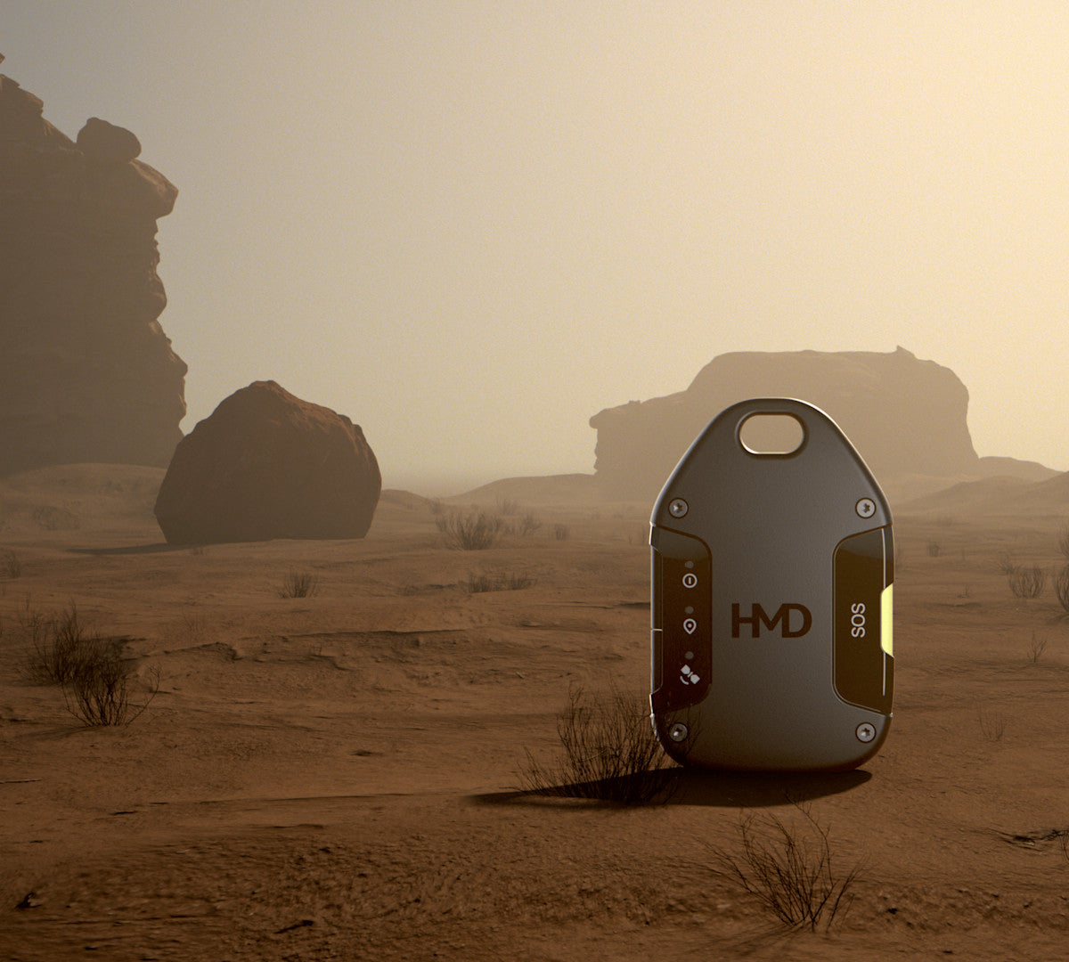 HMD OffGrid satellite communicator in Neon Black standing upright on sand in a desert scene with rock formations behind
