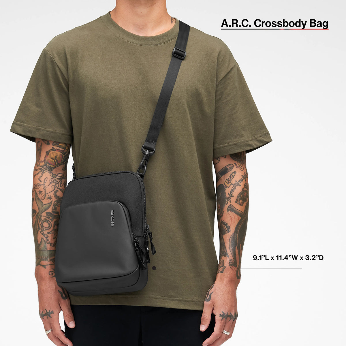 Front lifestyle image of a person wearing the Incase A.R.C. Crossbody Bag across the body, illustrating its comfortable fit and compact dimensions. The image highlights the adjustable shoulder strap and shows how the bag sits naturally for daily commuting, travel and casual use.