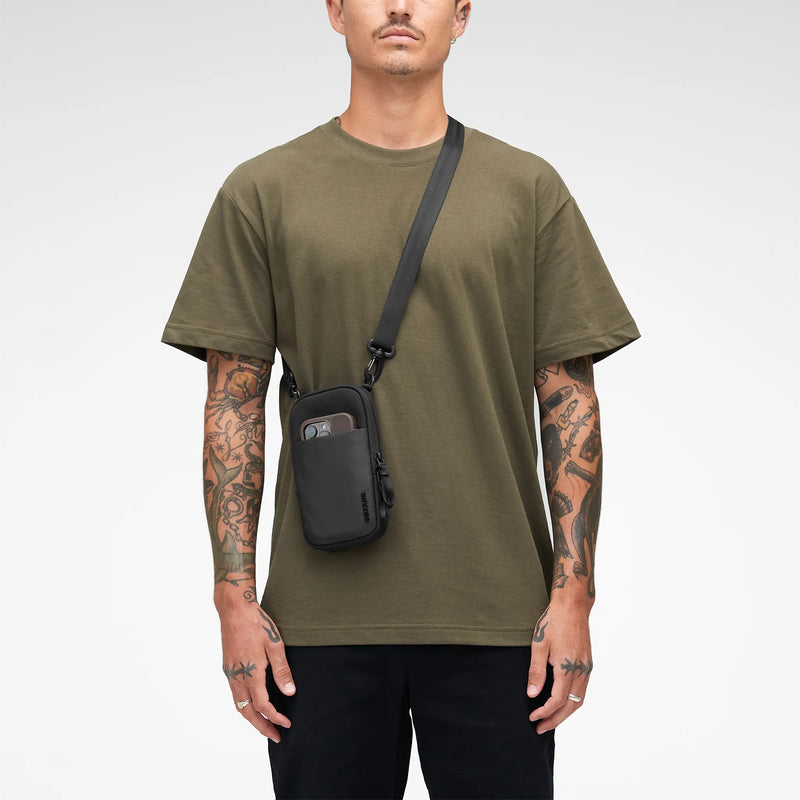 Studio image showing the crossbody configuration with the bag positioned comfortably on the side of the body. The photograph highlights versatile carrying options for commuting, travel and daily errands.