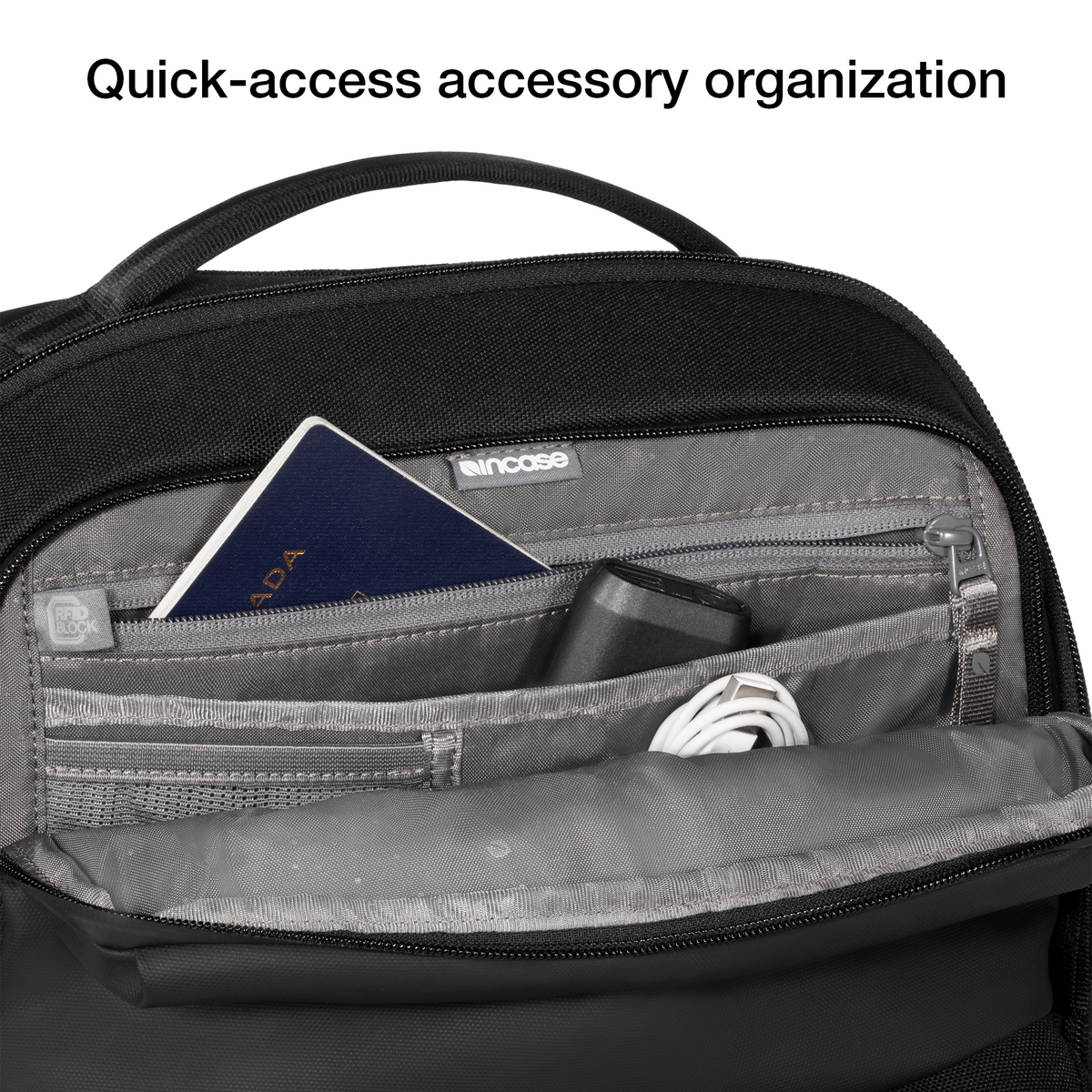Close-up of the open top pocket of the black Incase A.R.C. Commuter Pack holding a passport and cables, with Incase's caption on quick-access accessory organisation