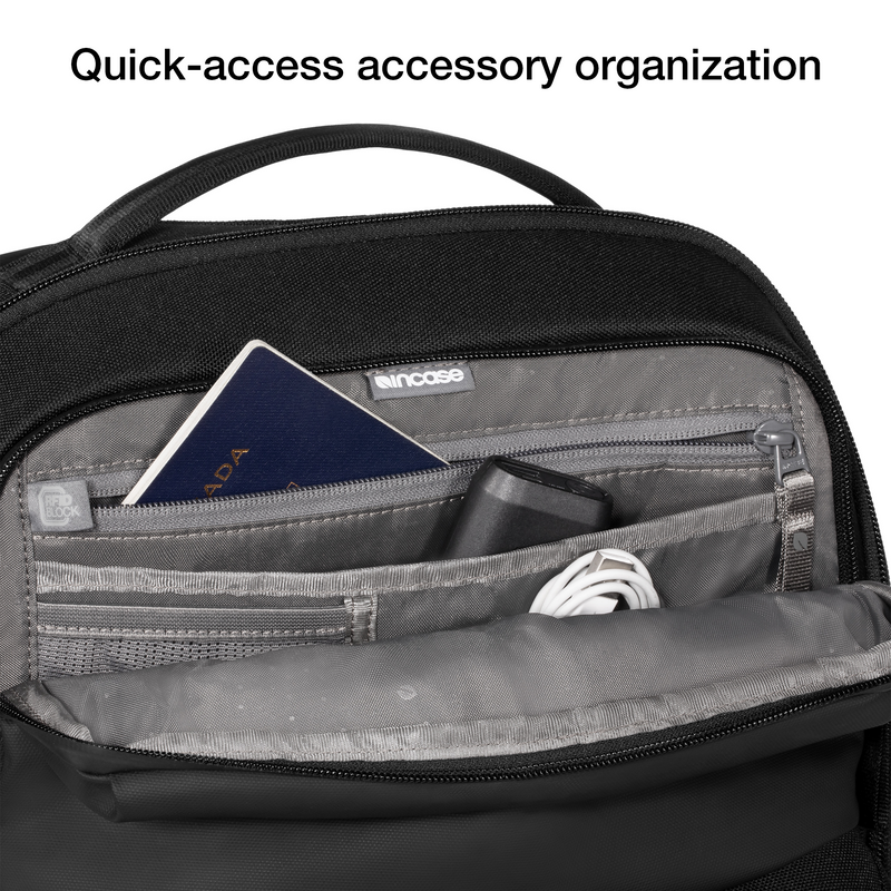 Close-up of the open top pocket of the black Incase A.R.C. Commuter Pack holding a passport and cables, with Incase's caption on quick-access accessory organisation