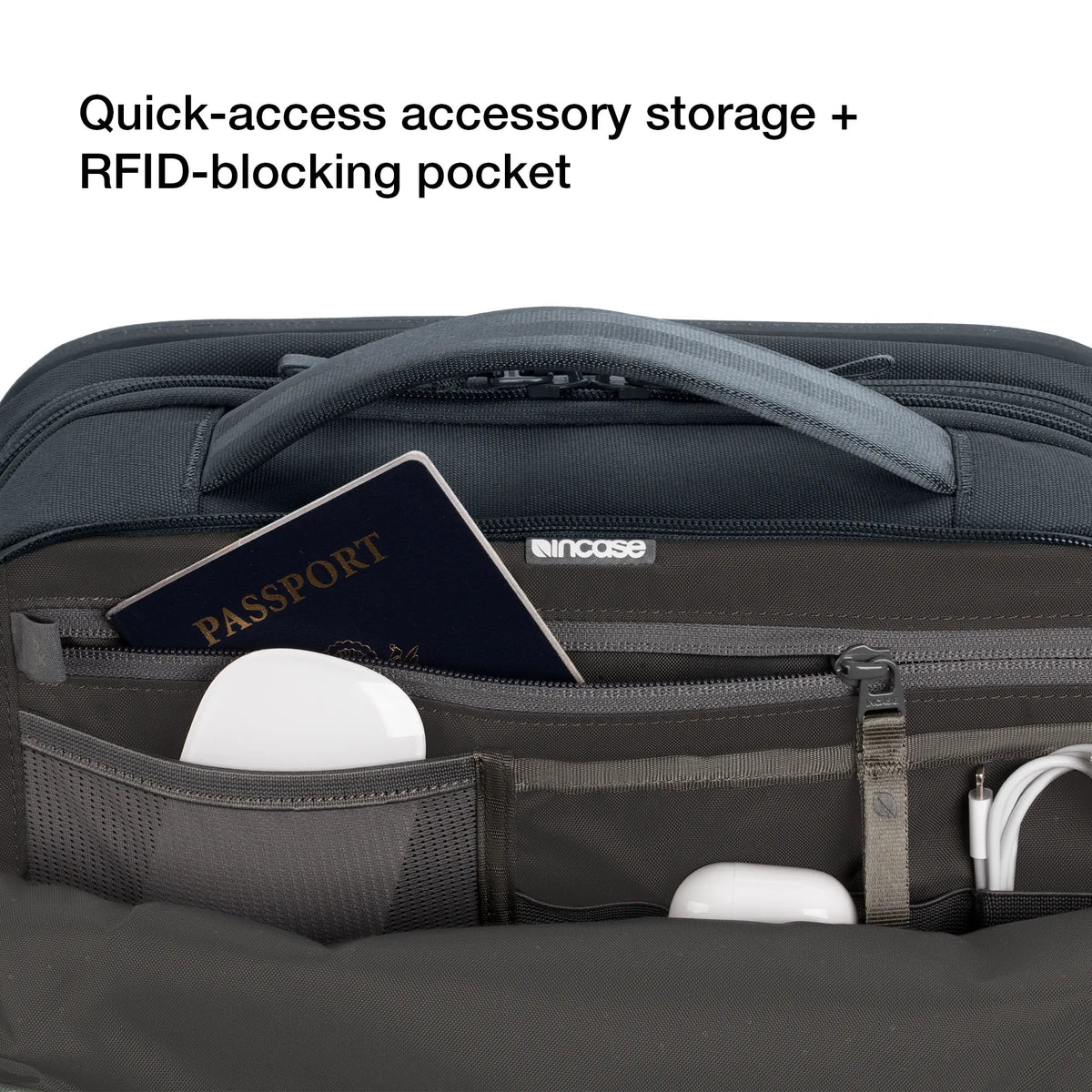 Open top pocket of the Incase A.R.C. Travel Pack holding a passport and earbuds, captioned Quick-access accessory storage and RFID-blocking pocket