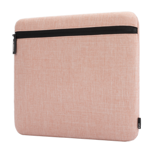 Incase Carry Zip Sleeve for 13-inch laptops in Blush Pink, angled three-quarter view, studio cut-out on a plain background