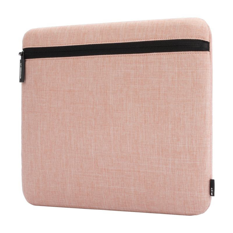 Incase Carry Zip Sleeve for 13-inch laptops in Blush Pink, angled three-quarter view, studio cut-out on a plain background