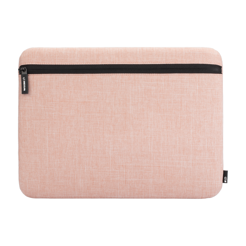 Incase Carry Zip Sleeve for 13-inch laptops in Blush Pink, front view with the zip running along the top, on a plain background