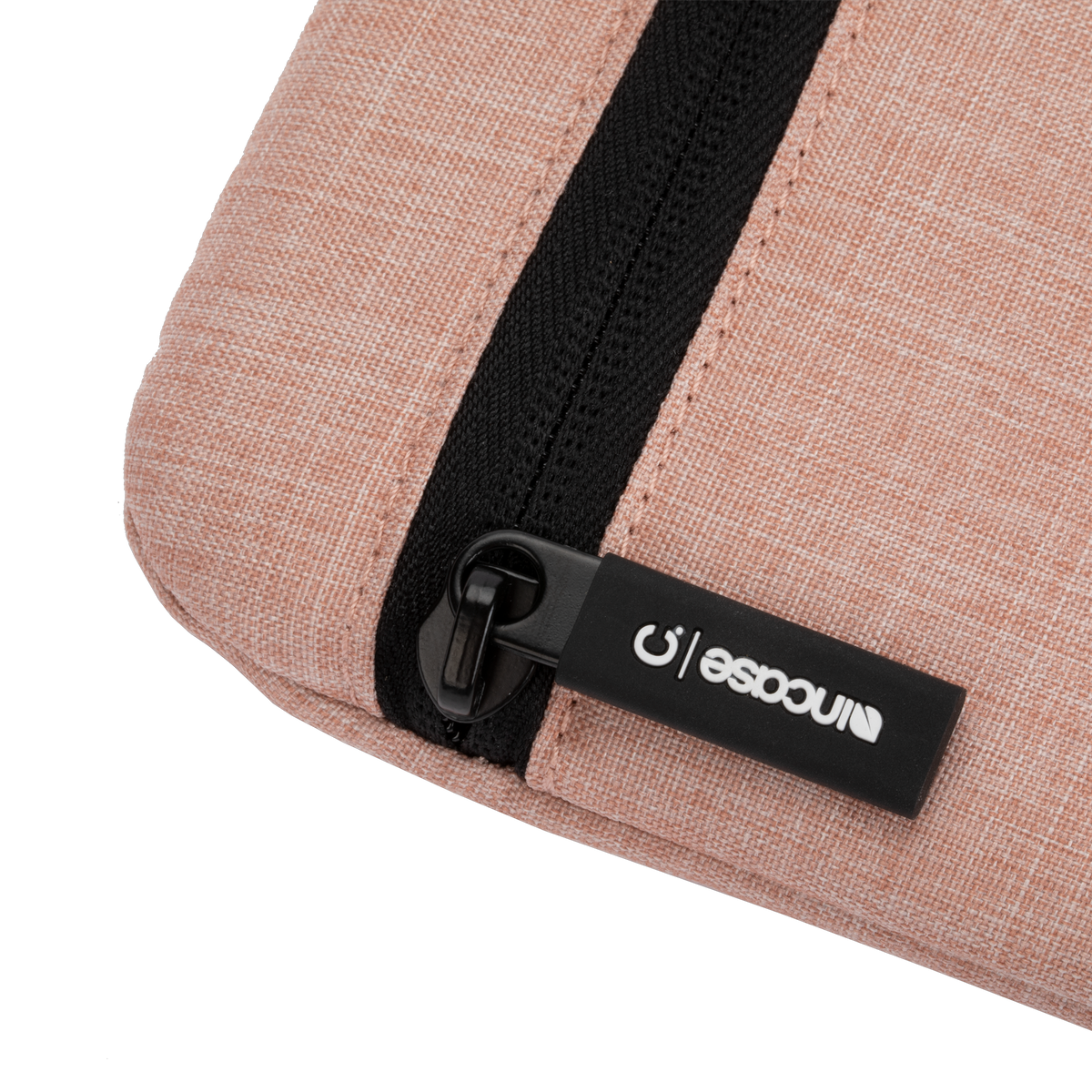 Incase Carry Zip Sleeve for 13-inch laptops in Blush Pink, close-up of the zip pull with its Incase tab on the heathered pink fabric