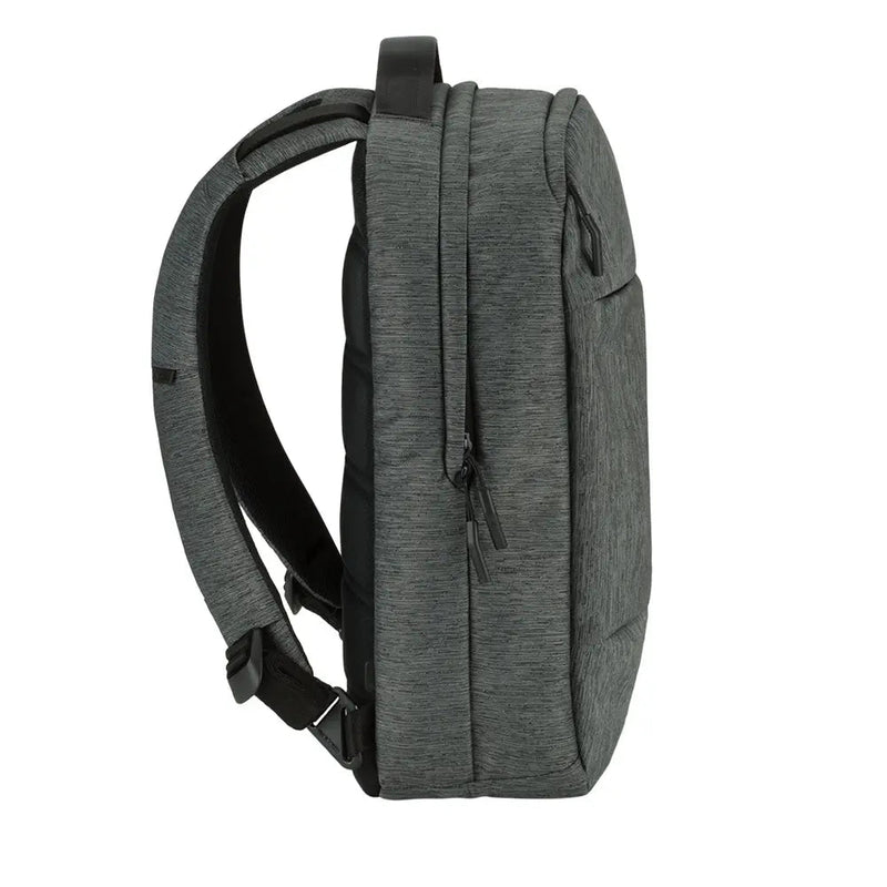 Incase City Compact Backpack in Heather Black, side three-quarter view showing a shoulder strap