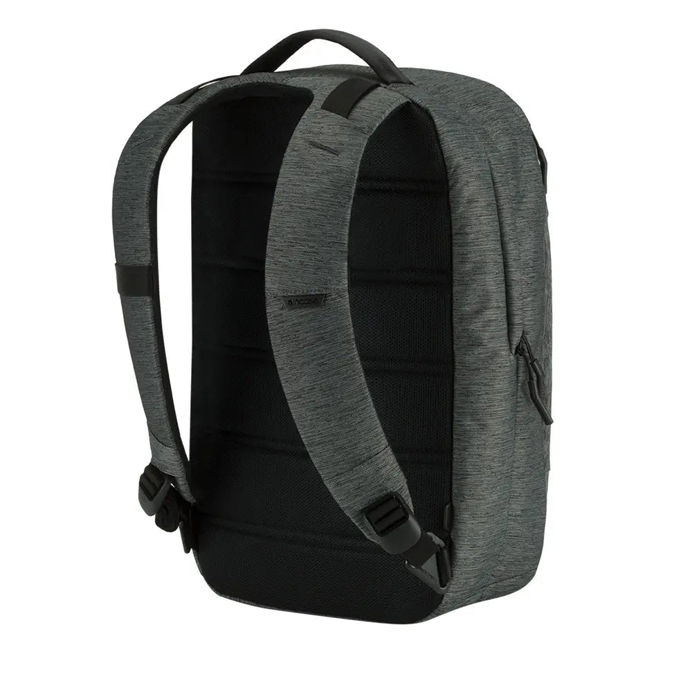 Incase City Compact Backpack in Heather Black, rear three-quarter view showing the padded back and shoulder straps