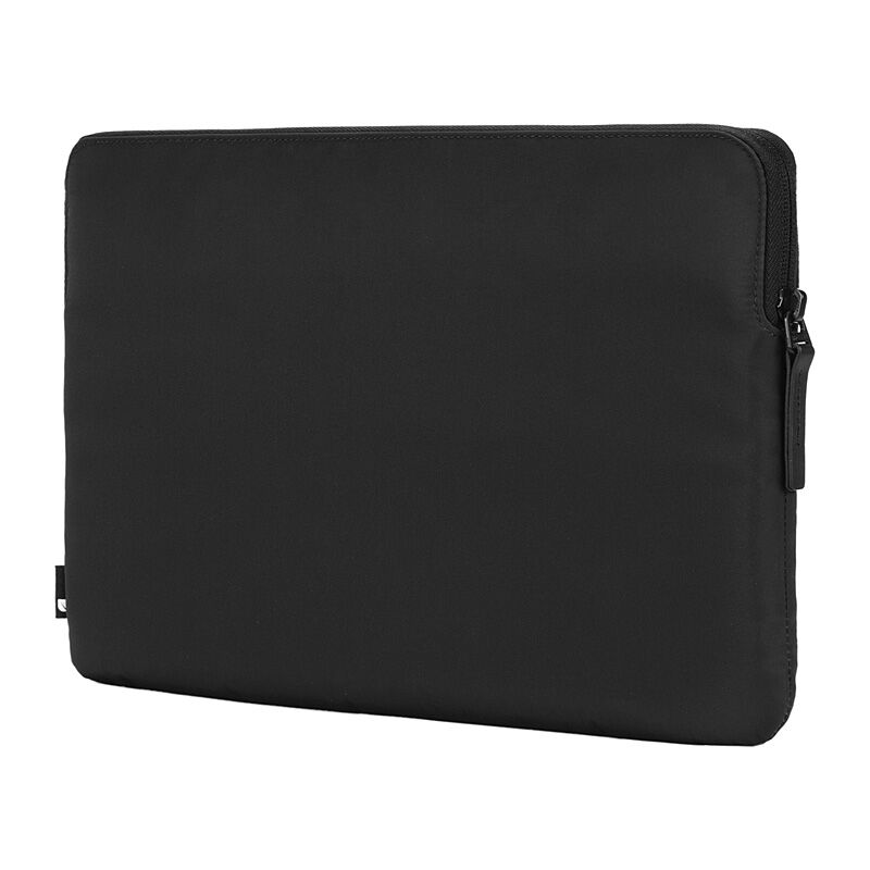 Back of the black Incase Compact Sleeve on a plain white background, with the main zip pull at the side