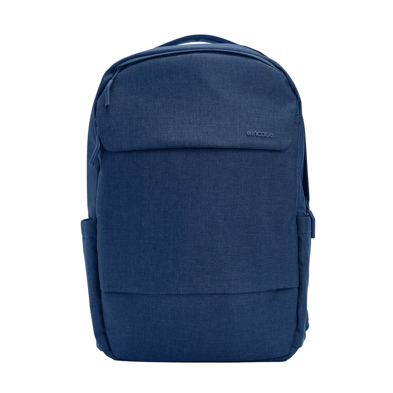 Incase Crosstown Backpack in Navy, front view on a plain background, showing the front pocket and top grab handle
