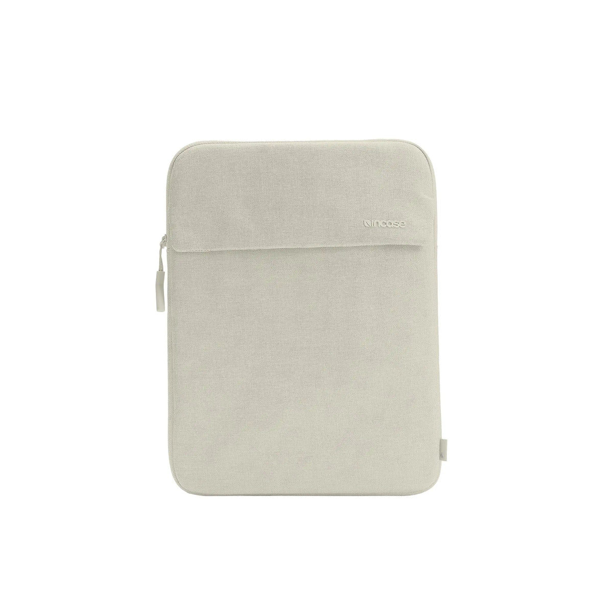 Front of the Limestone Crosstown 14-inch sleeve showing the external slip pocket with its flap, on a plain white background