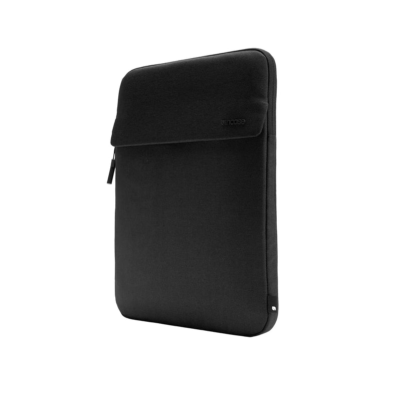 Incase Crosstown Sleeve for 16-inch laptops in Black, standing upright at a three-quarter angle on a plain white background