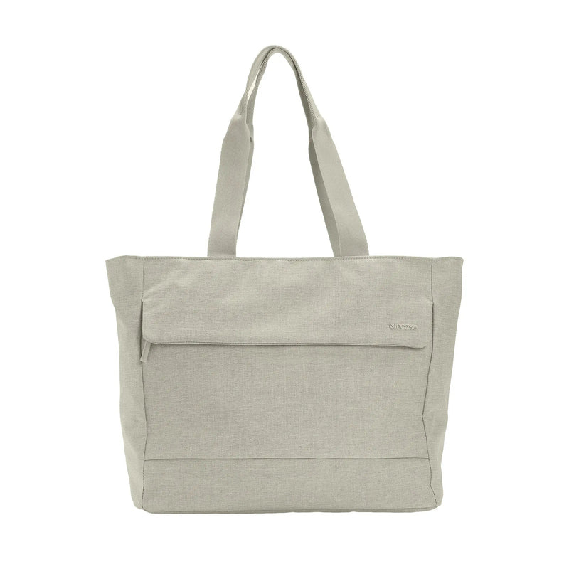 Incase Crosstown Tote in Limestone, a light beige-grey, front view on a plain white background with handles up