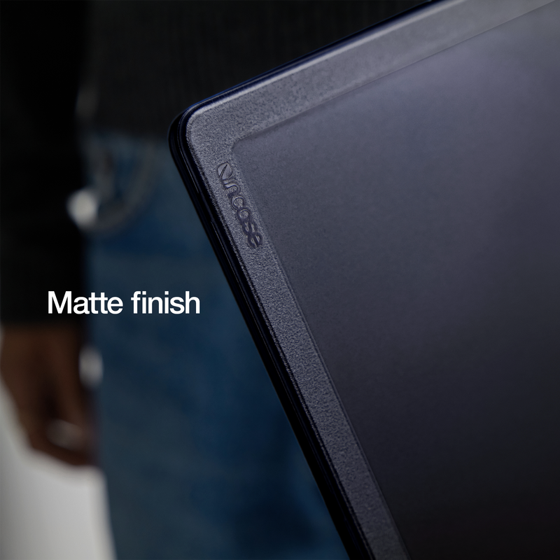 Close-up of a corner of the Black Edge Hardshell fitted to a dark blue MacBook Air, which shows through the tinted shell and gives it a navy look, with the overlay text Matte finish
