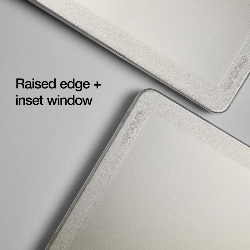 Two corners of the Clear Edge Hardshell overlapping to show the raised edge and inset window, with overlay text