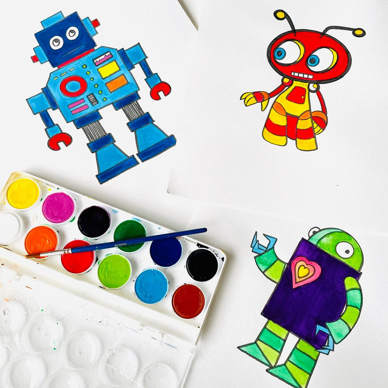 Jasart Byron watercolour palette with brush on a desk beside painted robot and bug drawings in blue, red, yellow and green