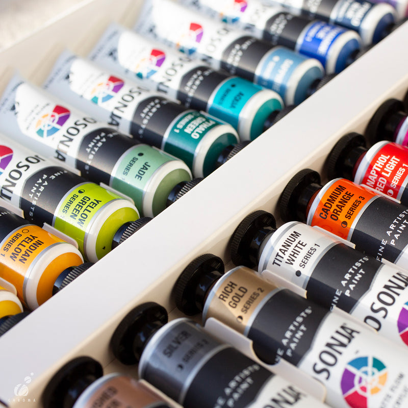 Range photo of many Jo Sonja's acrylic tubes packed in rows in a white tray