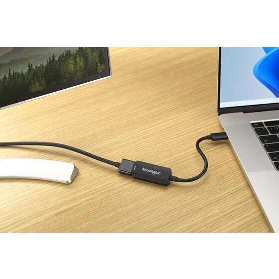 Kensington CV4200H adapter on a timber desk linking a laptop USB-C port to the HDMI cable of an external monitor