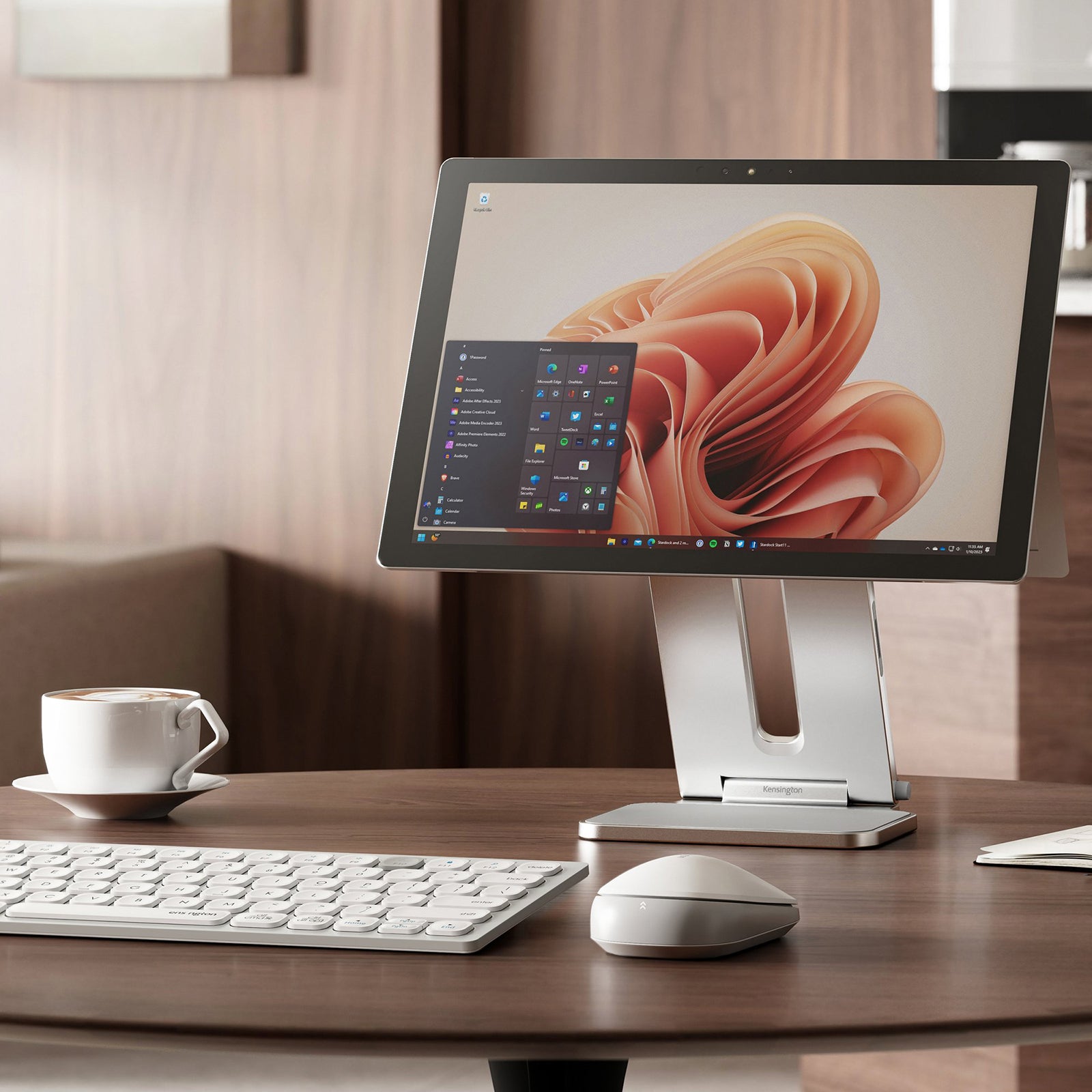 Front angled view of the Surface device supported by the Kensington stand. The image showcases the elevated screen position designed to improve posture, enhance viewing comfort and create an organised desktop environment.