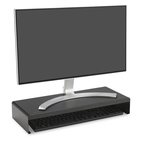Monitor raised on the black Kensington extra wide steel monitor stand with a keyboard stored underneath