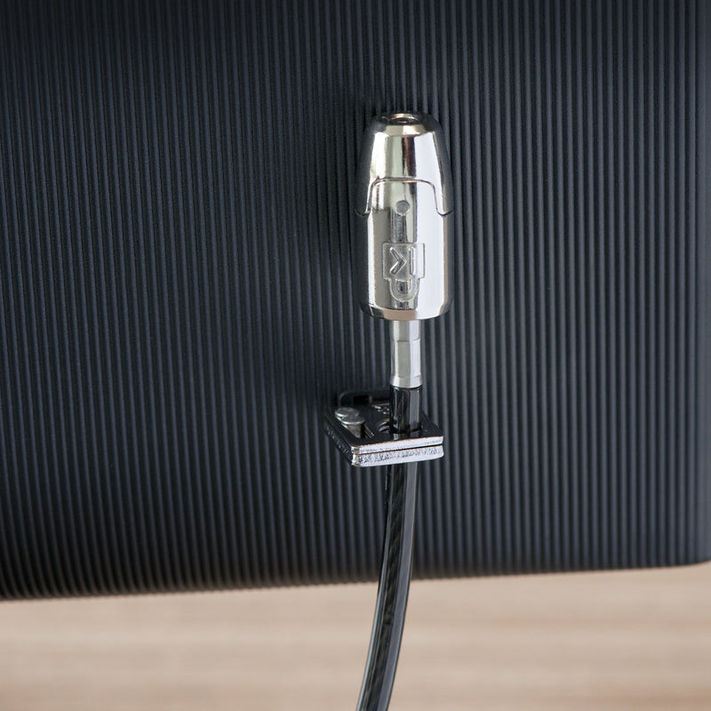 Close up of the Kensington T Bar lock head attached to a monitor security slot. The detailed view showcases the precision engineered lock mechanism and robust metal construction designed for professional device security.