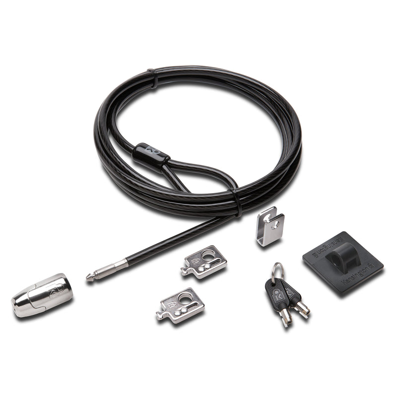 Product contents displayed on a neutral background including the carbon steel cable, lock head, anchor plate, adapters, cable trap and security keys. The image clearly shows all components included within the Kensington MicroSaver 2.0 T Bar Peripherals Kit.