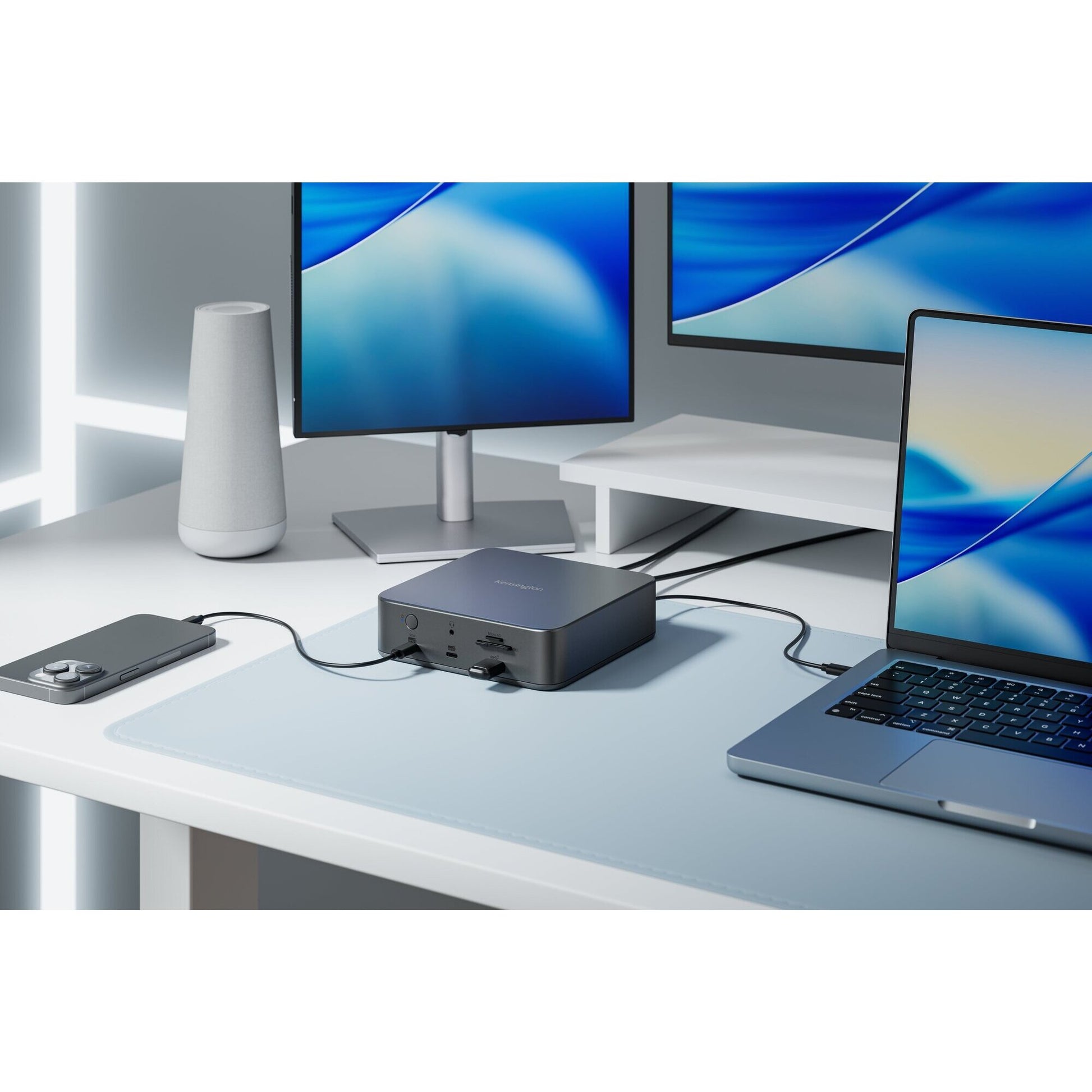 Kensington SD5010T5 dock beside a laptop driving a dual monitor setup on a modern home office desk