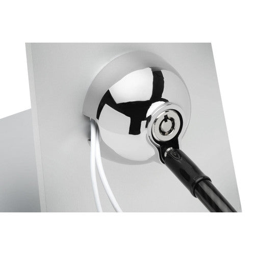 Close up of the Kensington SafeDome chrome dome with the lock head clicked in and white cables passing underneath