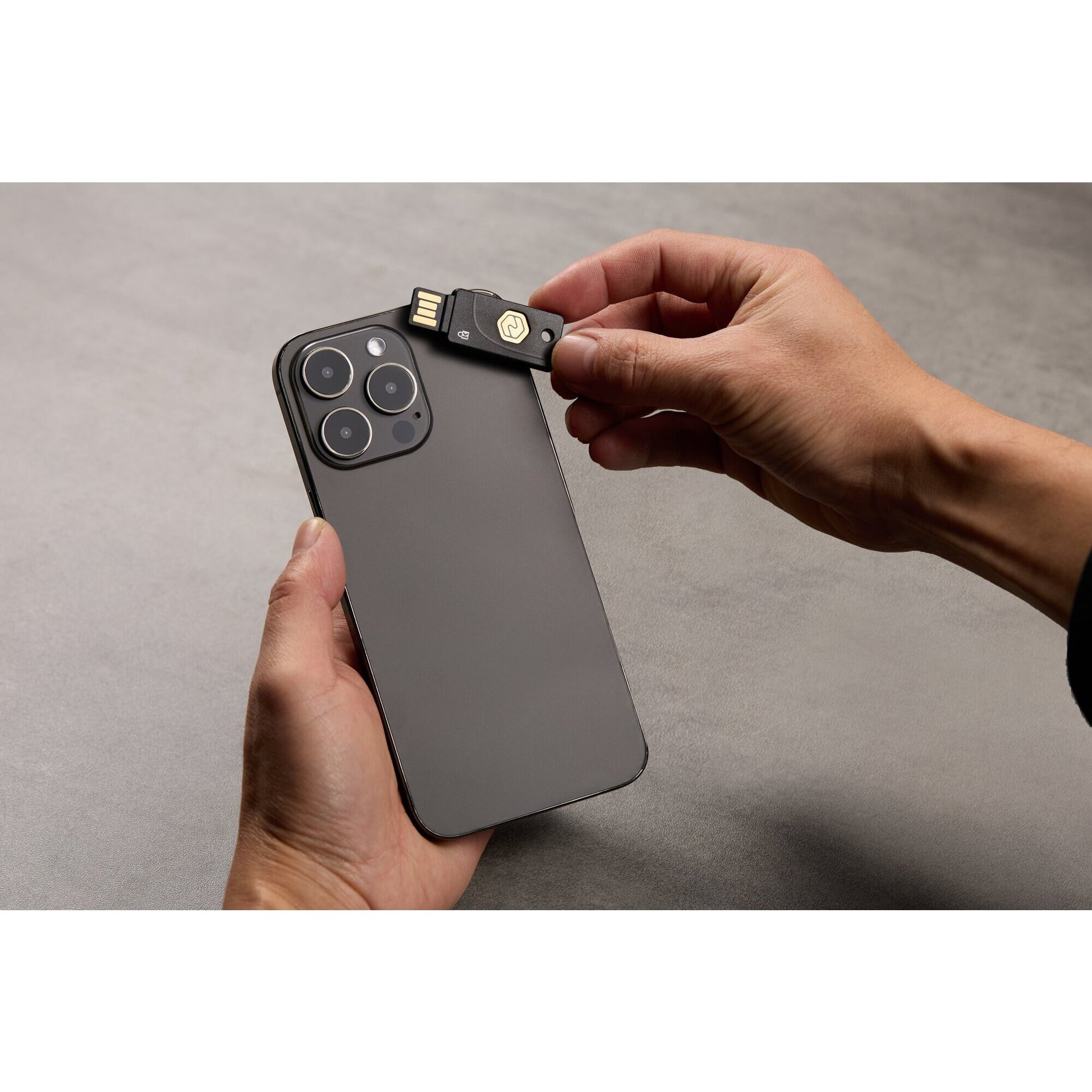 Kensington VeriMark NFC Plus USB-A security key shown with its retail packaging on a white background