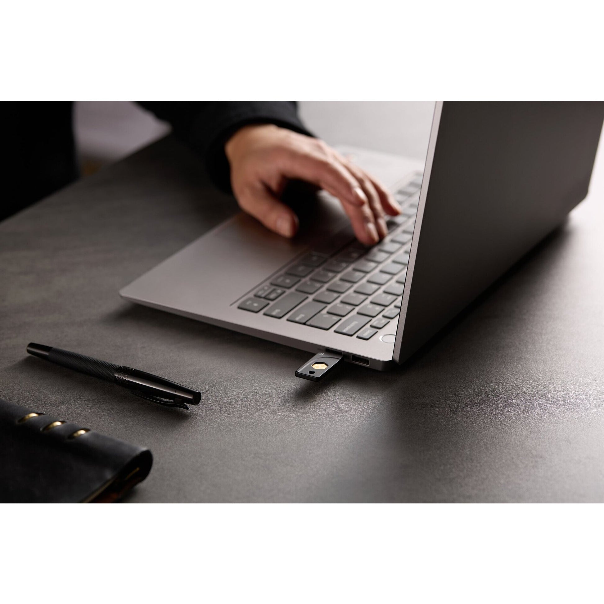 Kensington VeriMark NFC Plus security key shown against a plain background illustrating cross platform use across laptop and mobile devices
