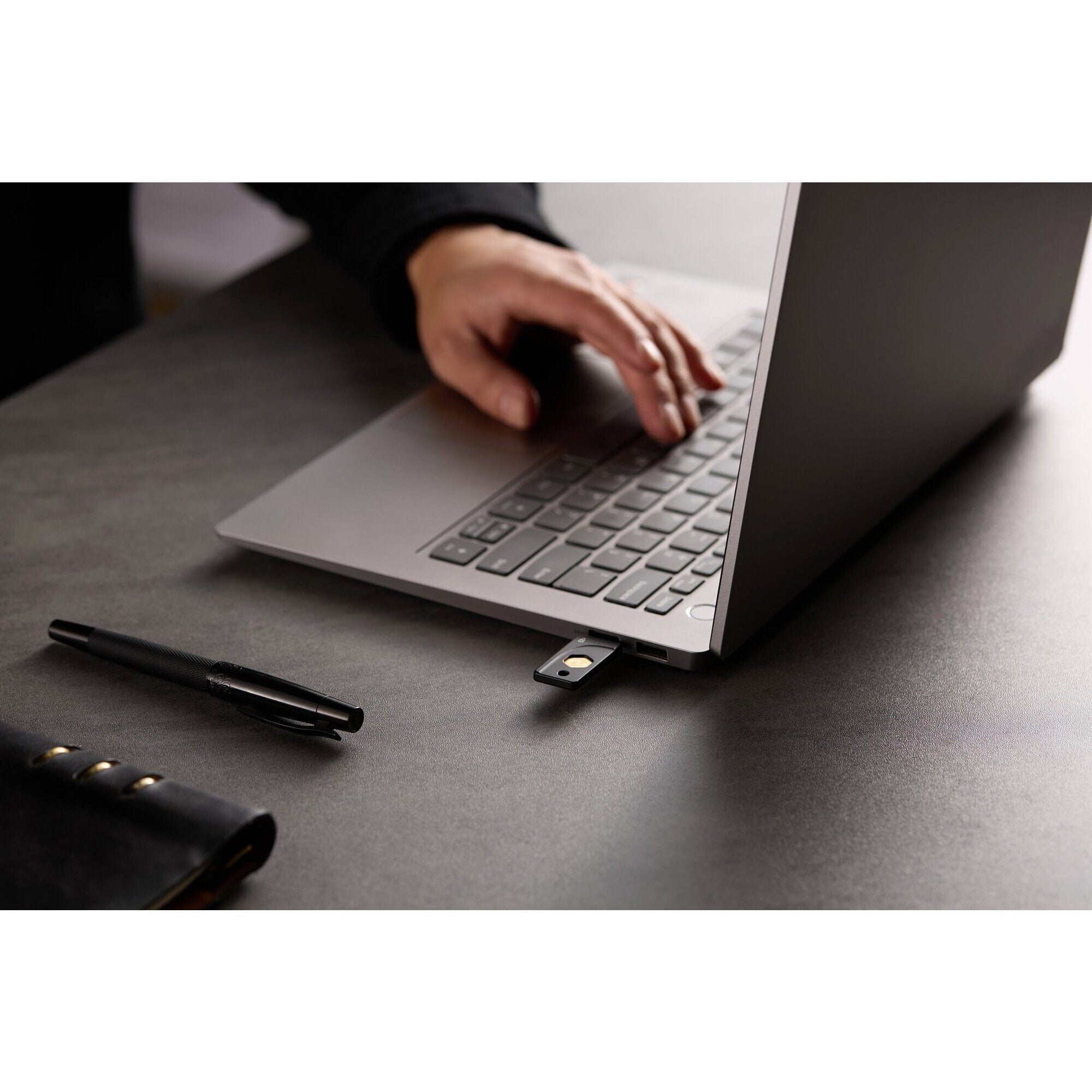 Kensington VeriMark NFC Plus security key shown against a plain background illustrating cross platform use across laptop and mobile devices