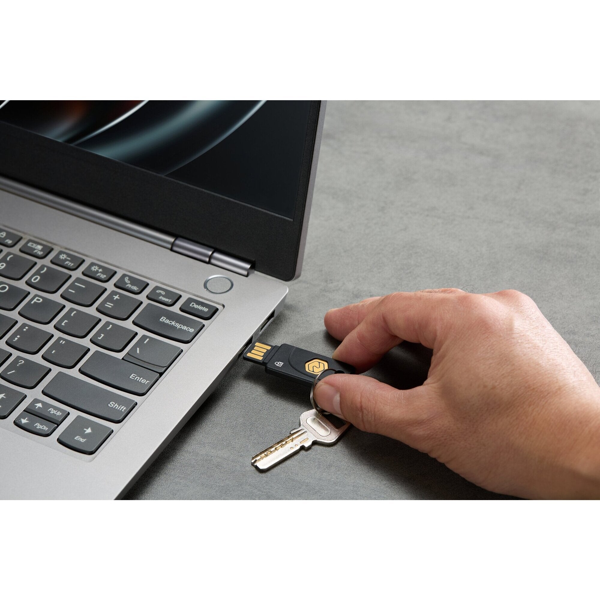 The VeriMark NFC Plus security key shown attached to a keyring, demonstrating the keychain ready form factor for everyday carry