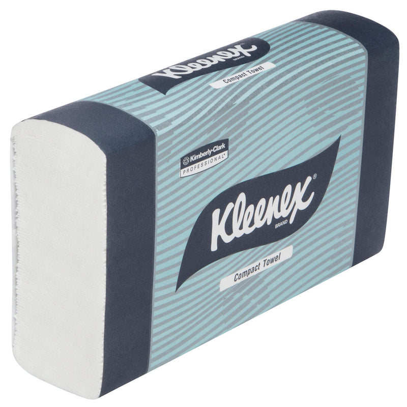 Single sealed pack of Kleenex Compact Towels viewed at an angle, showing the teal striped and navy Kimberly-Clark Professional wrapper with the folded white towel stack exposed at the open end