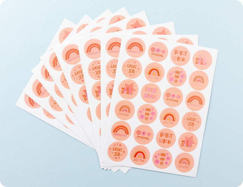 Sticker sheets from the Peachy Praise book fanned out to show the peach palette designs and encouragement wording.