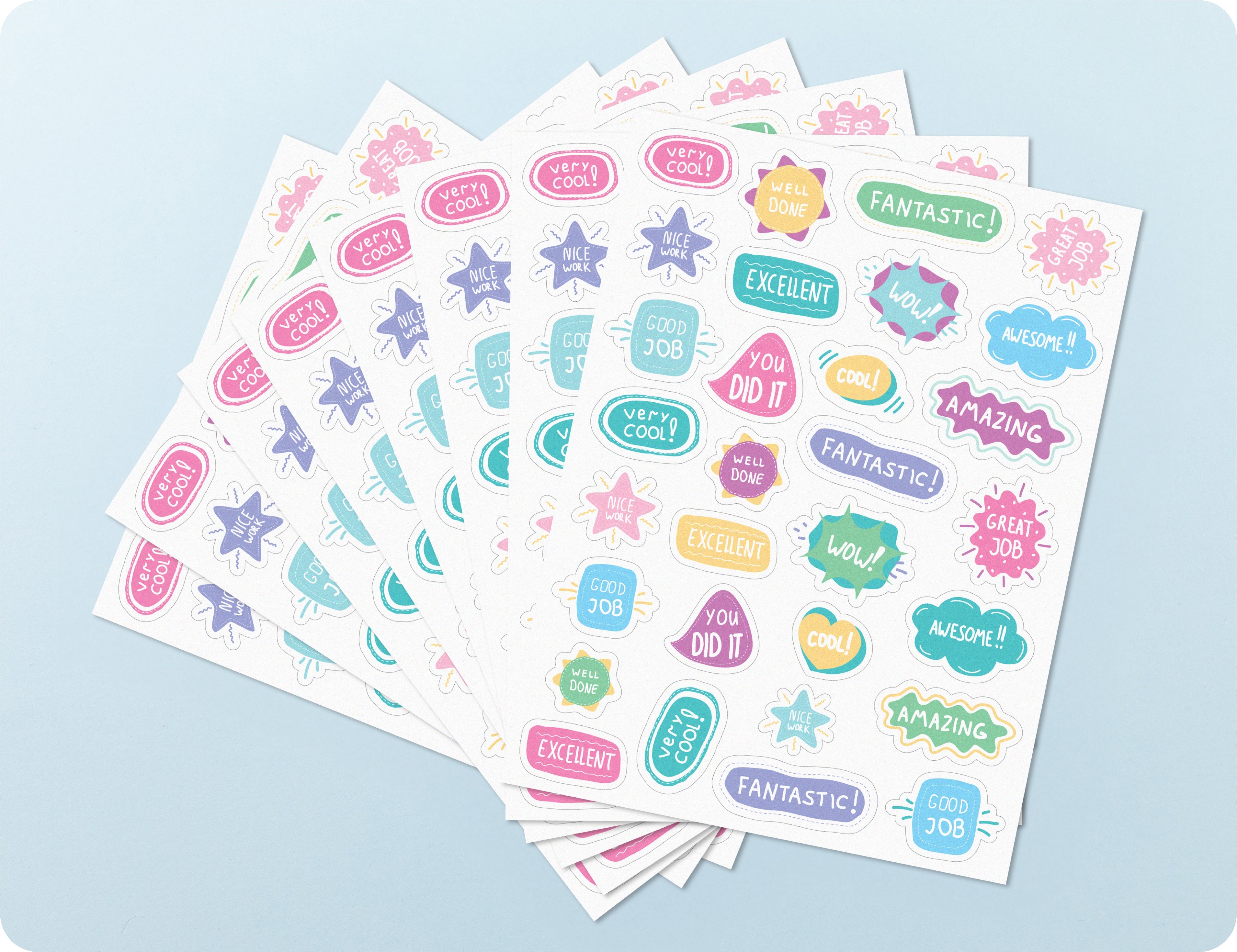 Open sticker book showing several pastel sheets fanned out, with the individual merit sticker designs and phrases visible.