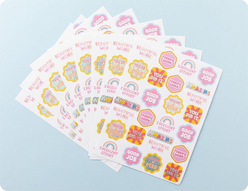 Sticker sheets from the Retro Rewards book fanned out to show the pattern range and effort-focused wording.