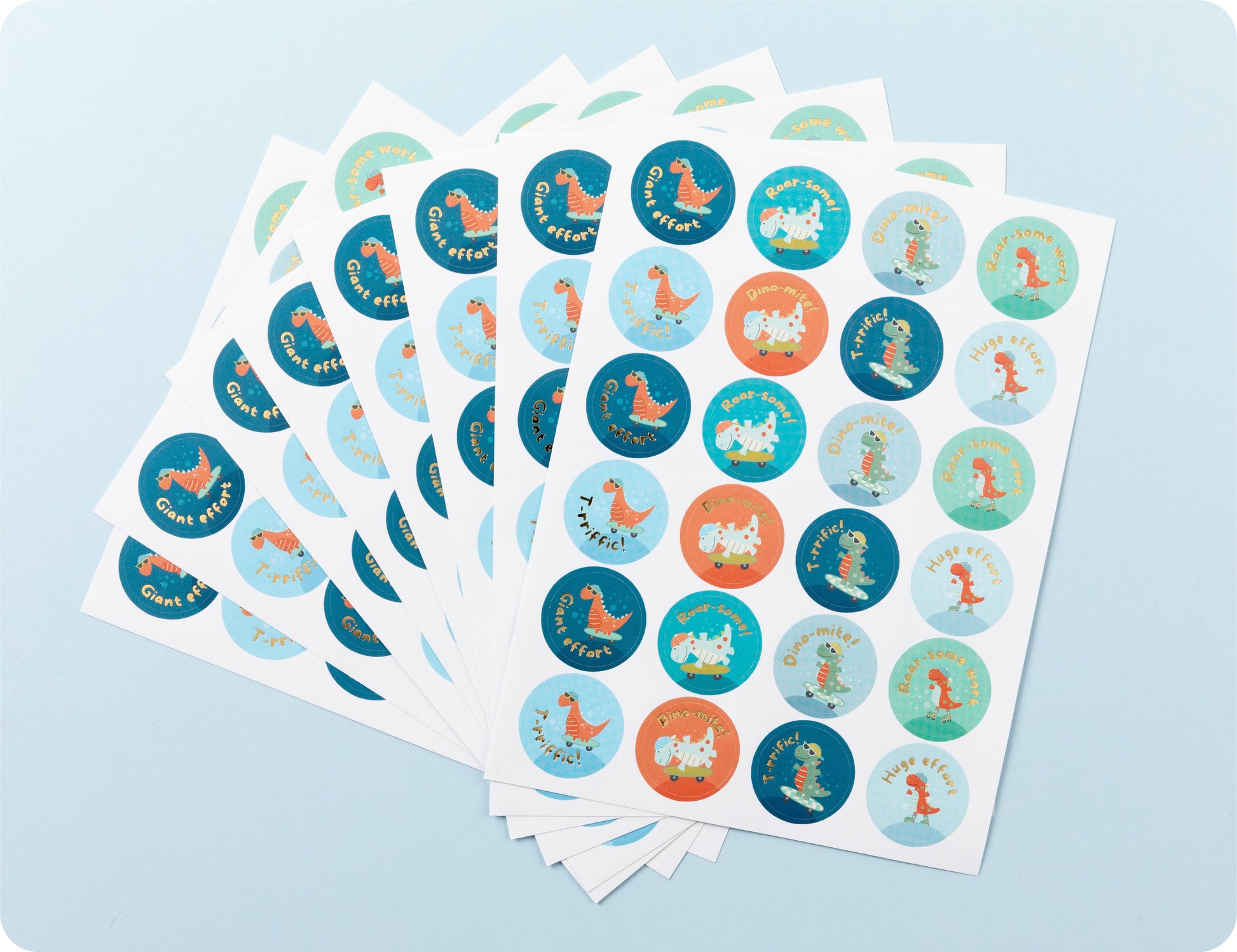 Sticker sheets from the Roar-some Recognition book fanned out to show the dinosaur designs and playful phrases.