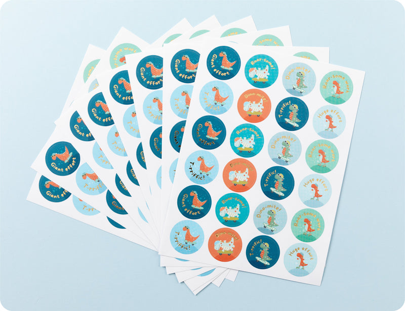 Sticker sheets from the Roar-some Recognition book fanned out to show the dinosaur designs and playful phrases.