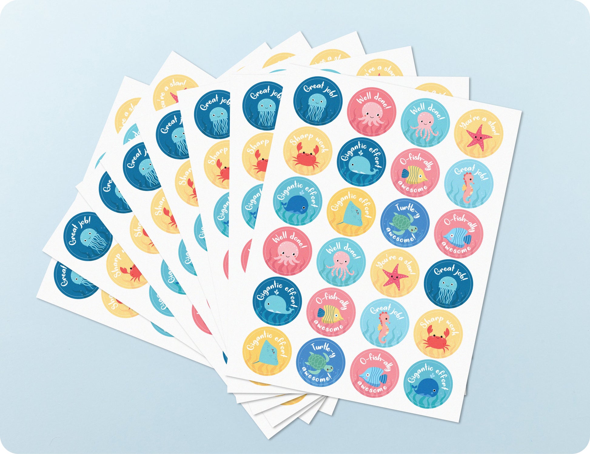 Sticker sheets from the Sea of Success book fanned out to show the range of sea animal designs.