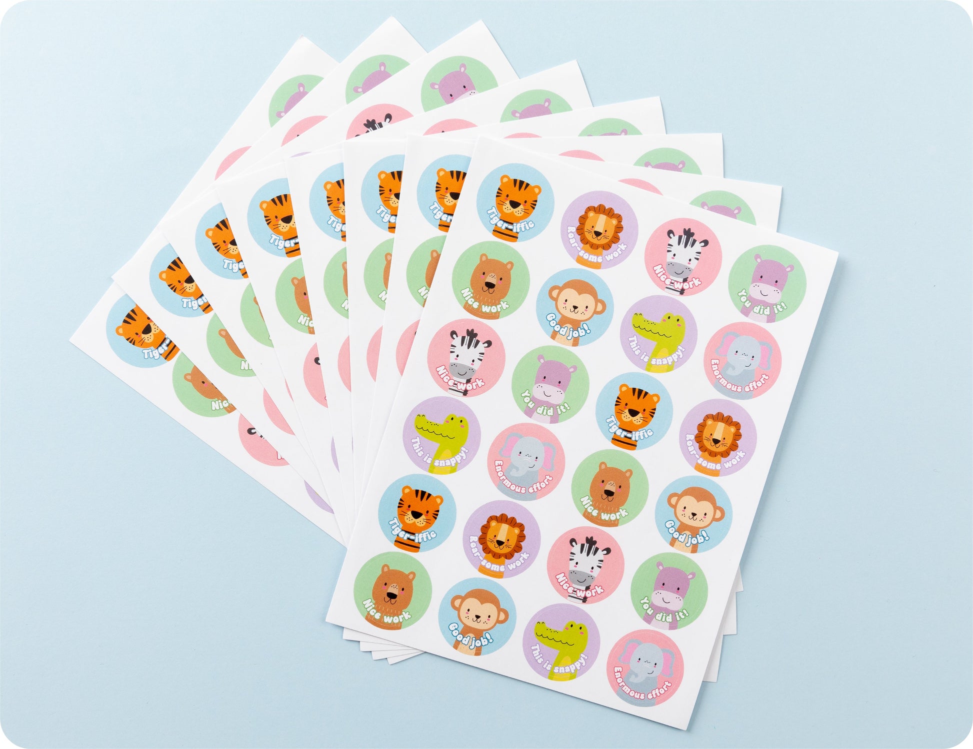 Sticker sheets from the Wild Rewards book fanned out to show the range of animal designs.