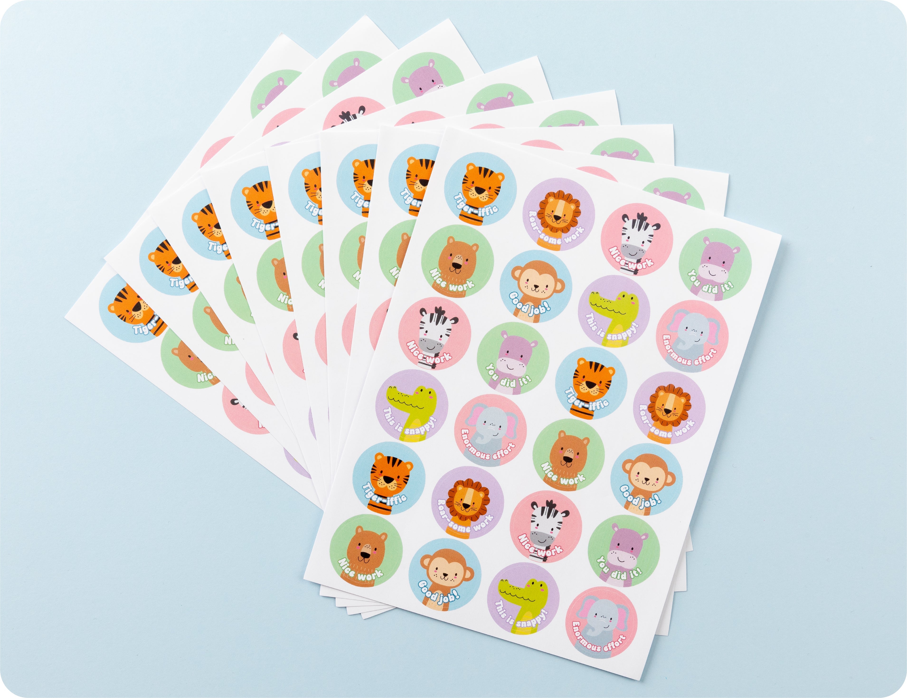 Sticker sheets from the Wild Rewards book fanned out to show the range of animal designs.