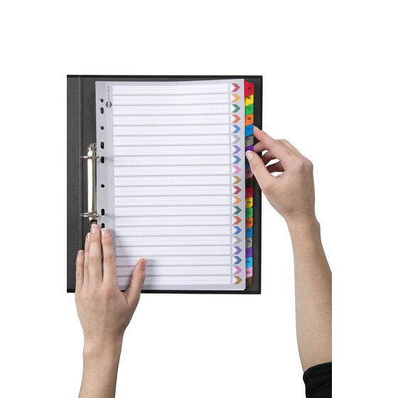Hand turning a coloured A to Z tab in a Marbig reinforced A4 divider set filed in a black 2 ring binder