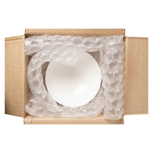 Open brown carton with inflated bubble film coiled around a white bowl, showing air cushion film used as void fill