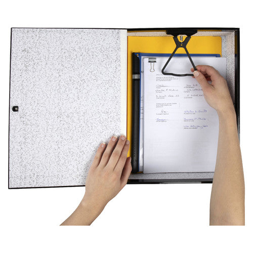 Hands placing foolscap papers under the black plastic clip of an open Marbig Heavy Duty box file