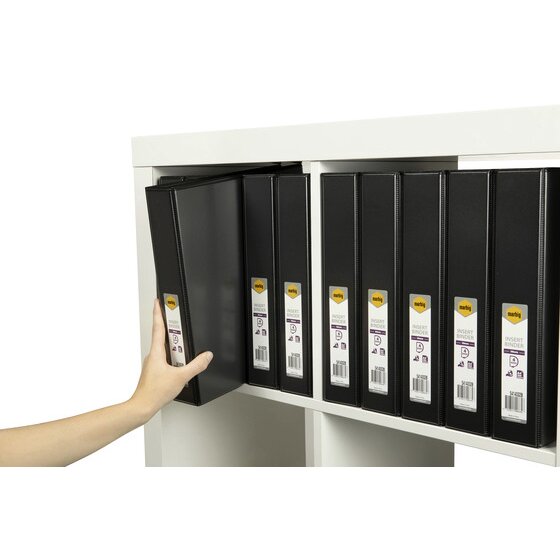 Hand pulling a black Marbig insert binder from a shelf of black binders with 38mm 4 ring spine labels