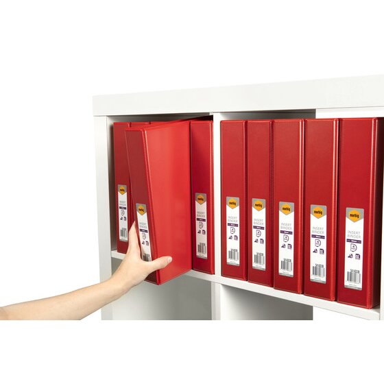 Hand taking a red Marbig insert binder from a shelf of red binders labelled 38mm and 4 ring