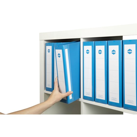 Hand sliding a blue Marbig Deluxe binder out of a white shelf of matching blue binders with labelled spines